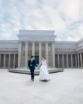 A couple crossing the colonnaded courtyard of the Legion of Honor