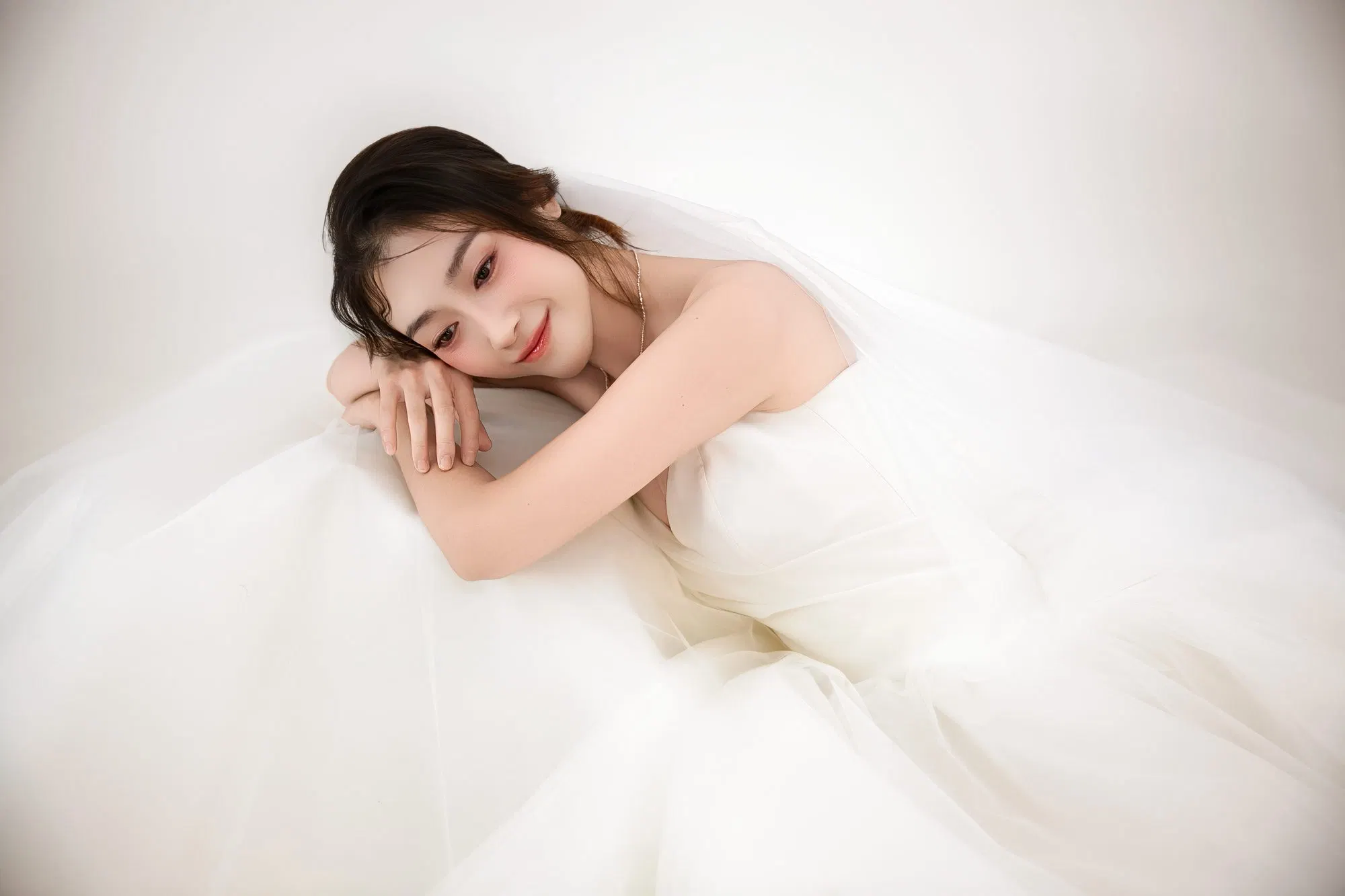 Bridal portrait in a tulle gown, frame 5 of 16