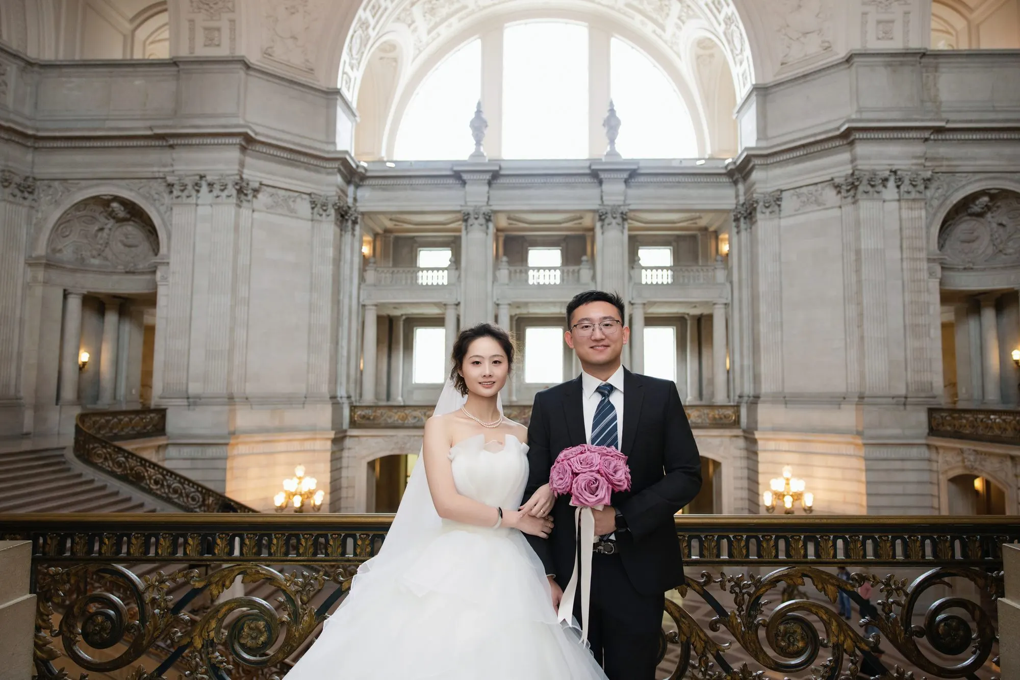 City Hall wedding with a ball gown and pink roses, frame 11 of 24