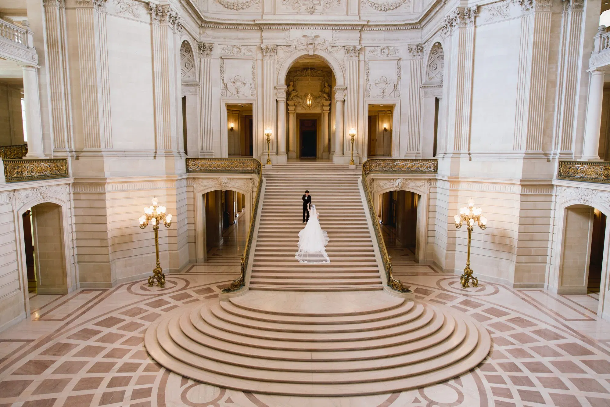 Bride with a long train at City Hall, frame 8 of 9