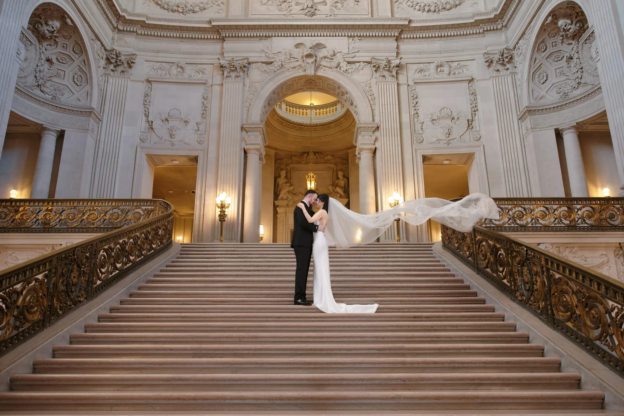 City Hall wedding with calla lilies and a long lace veil, frame 13 of 25
