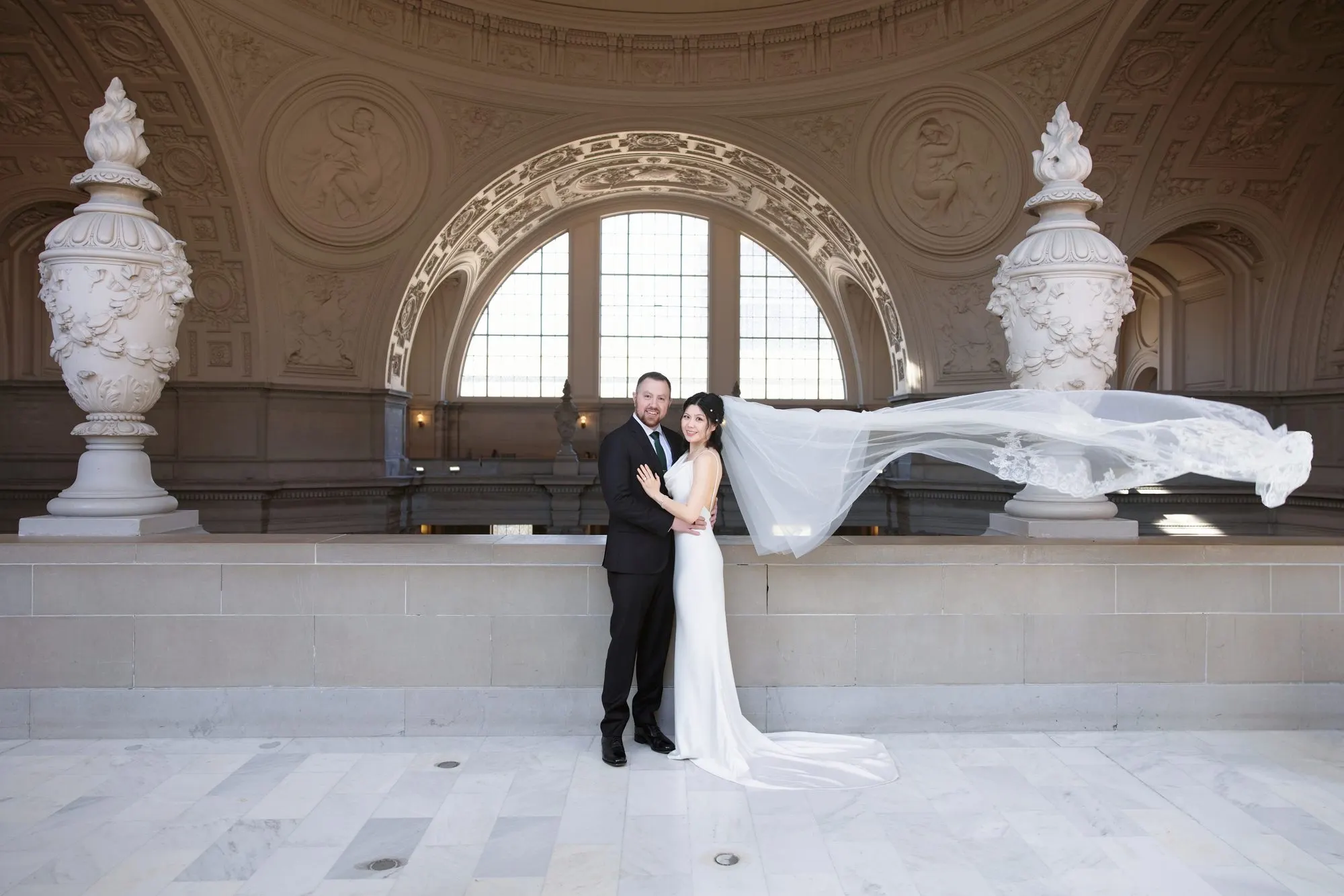 City Hall wedding with calla lilies and a long lace veil, frame 18 of 25