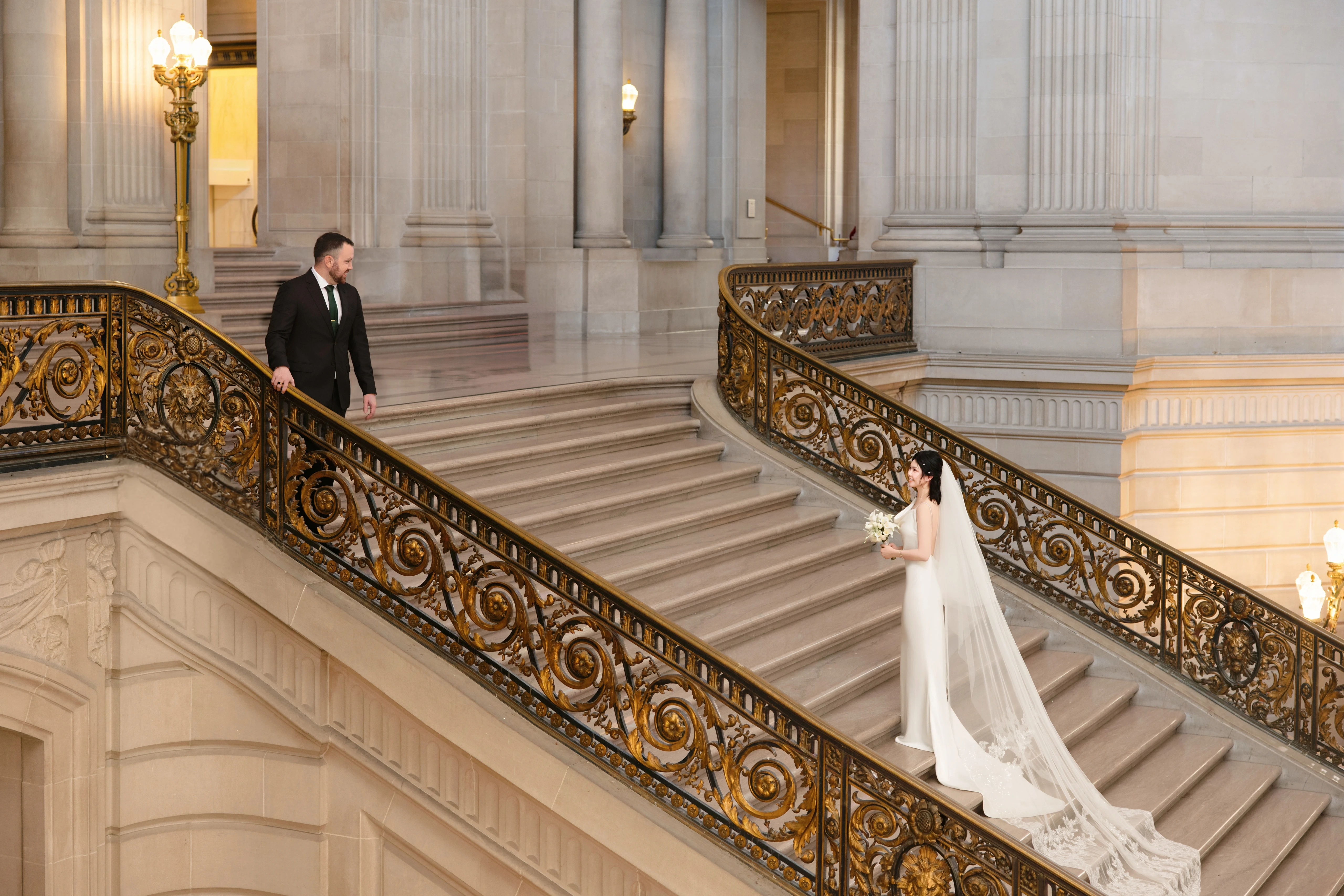 City Hall wedding with calla lilies and a long lace veil, frame 7 of 25
