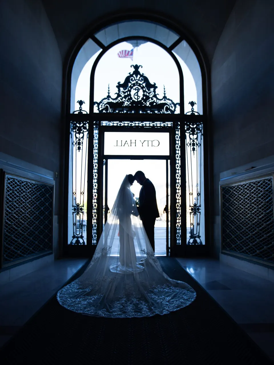 City Hall wedding with calla lilies and a long lace veil, frame 25 of 25