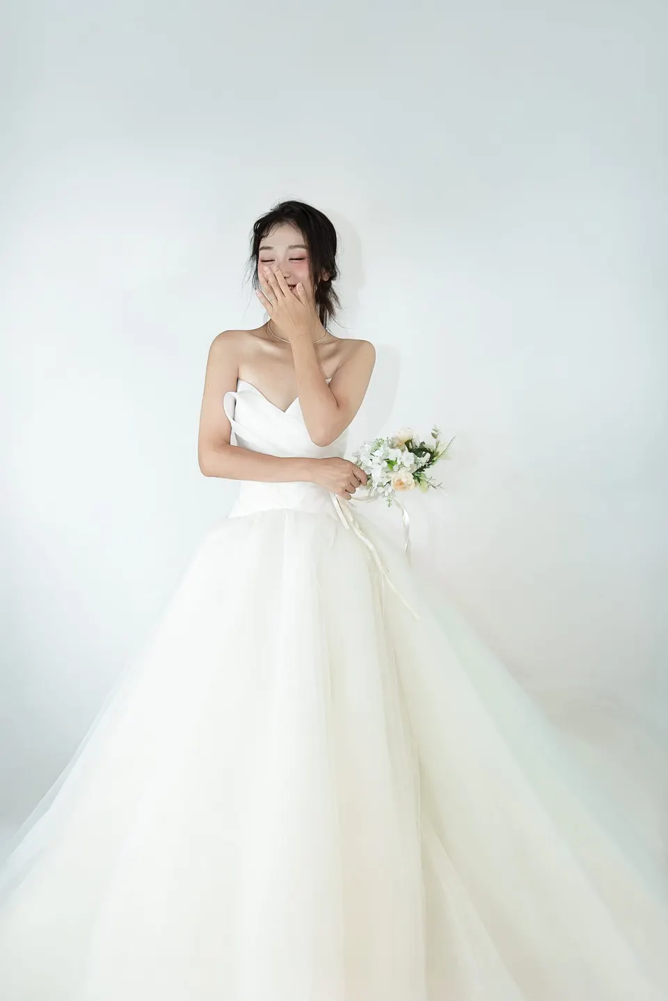 Bridal portrait in a tulle gown, frame 13 of 16
