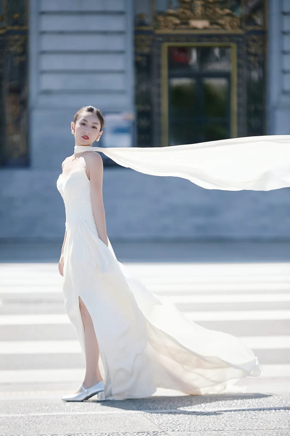 Bride in a bow-front gown at City Hall, frame 2 of 24