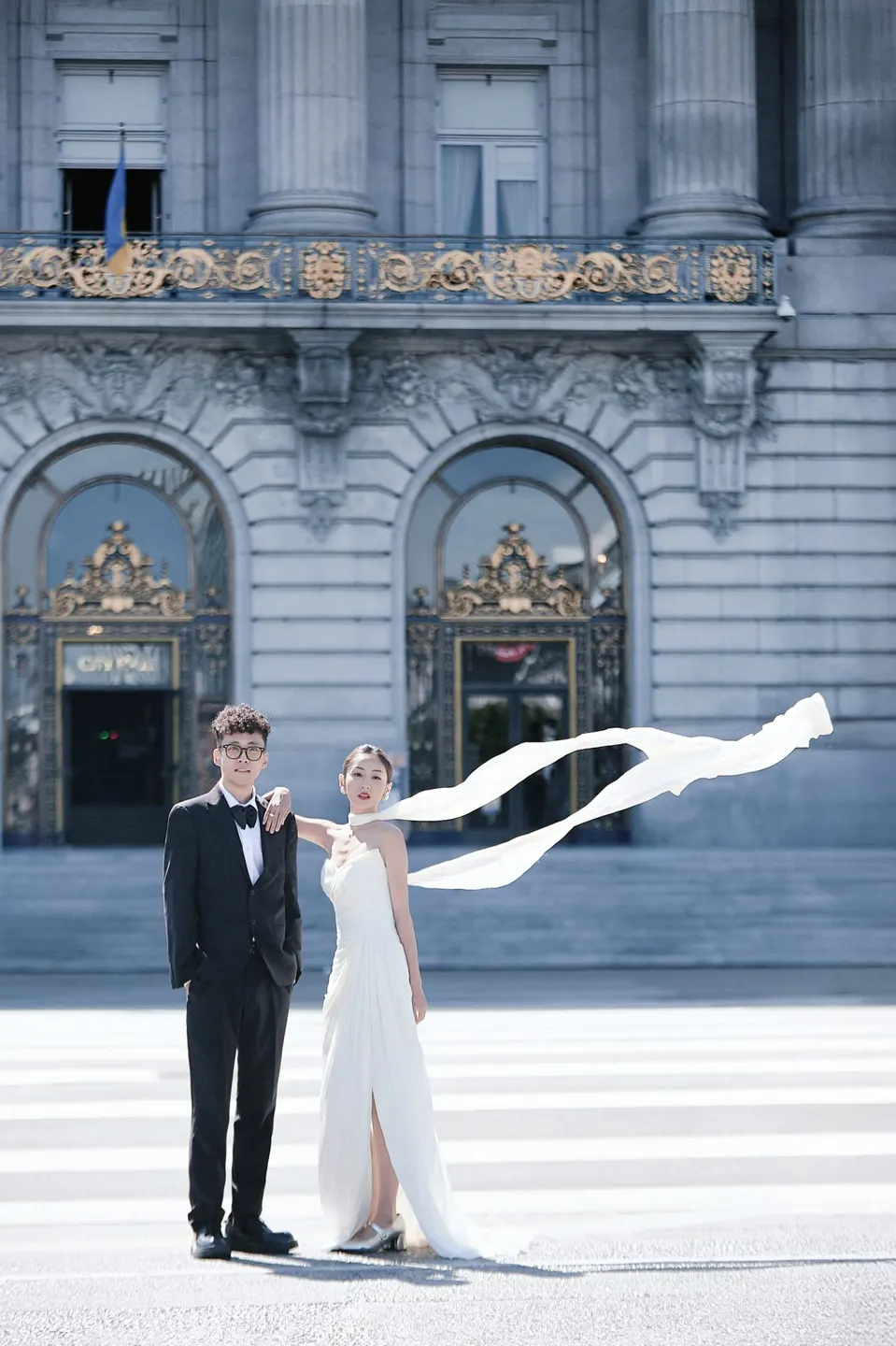 Bride in a bow-front gown at City Hall, frame 3 of 24