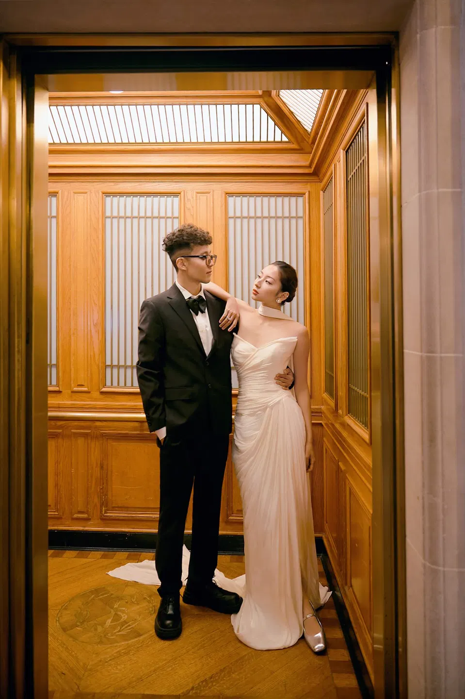 Bride in a bow-front gown at City Hall, frame 5 of 24