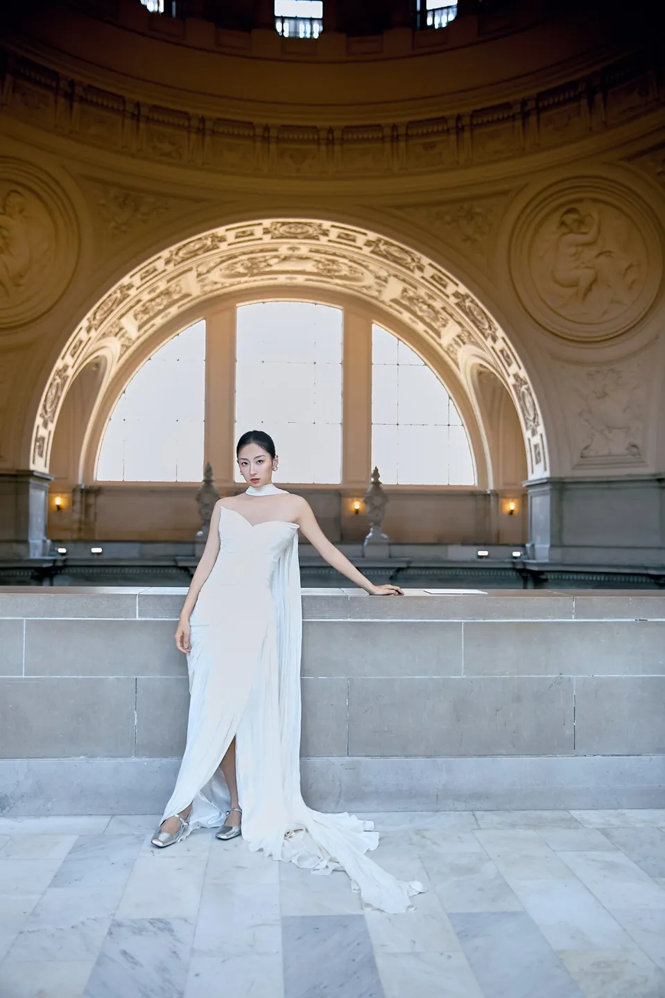 Bride in a bow-front gown at City Hall, frame 8 of 24