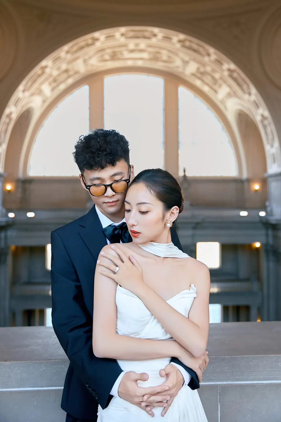 Bride in a bow-front gown at City Hall, frame 10 of 24