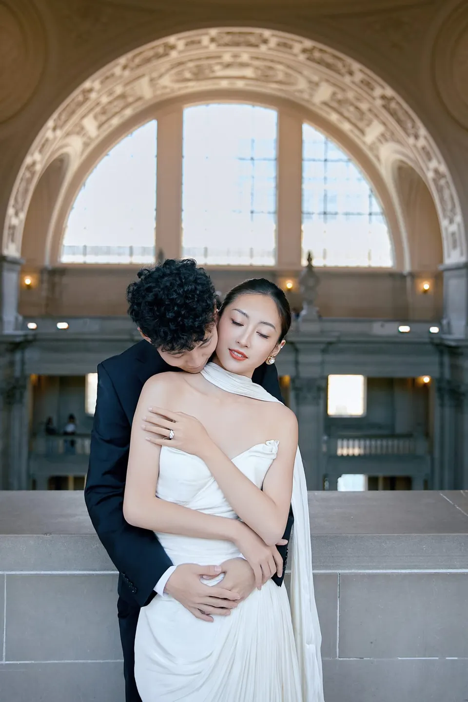 Bride in a bow-front gown at City Hall, frame 11 of 24