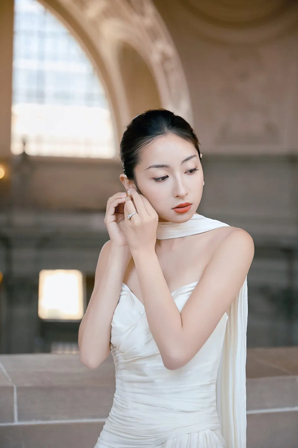 Bride in a bow-front gown at City Hall, frame 12 of 24