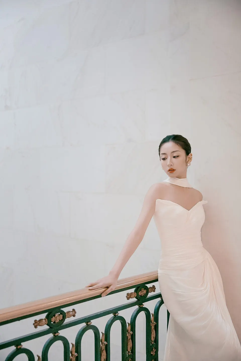 Bride in a bow-front gown at City Hall, frame 13 of 24