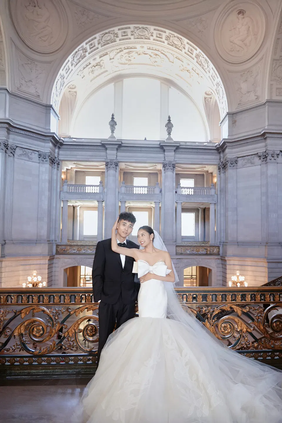 Bride in a bow-front gown at City Hall, frame 19 of 24