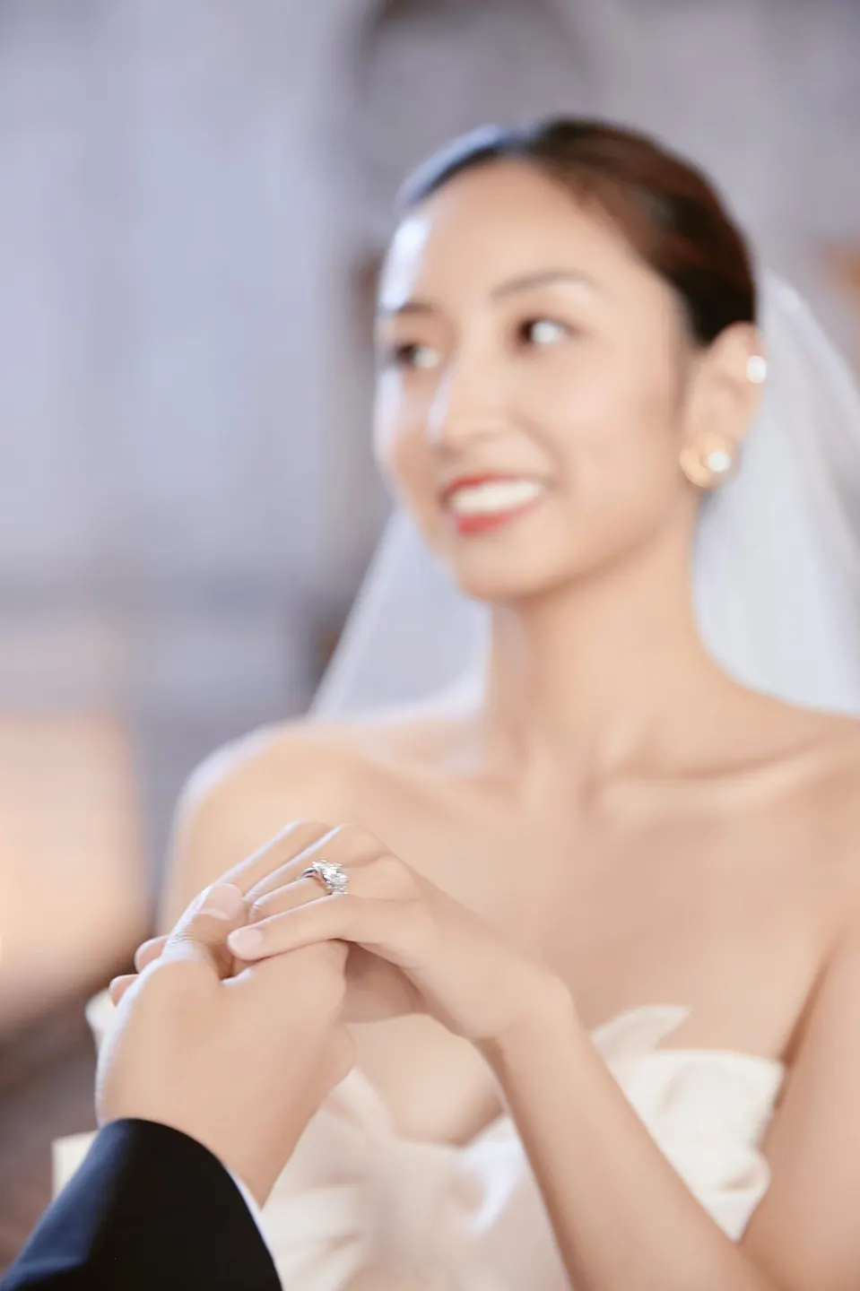 Bride in a bow-front gown at City Hall, frame 21 of 24