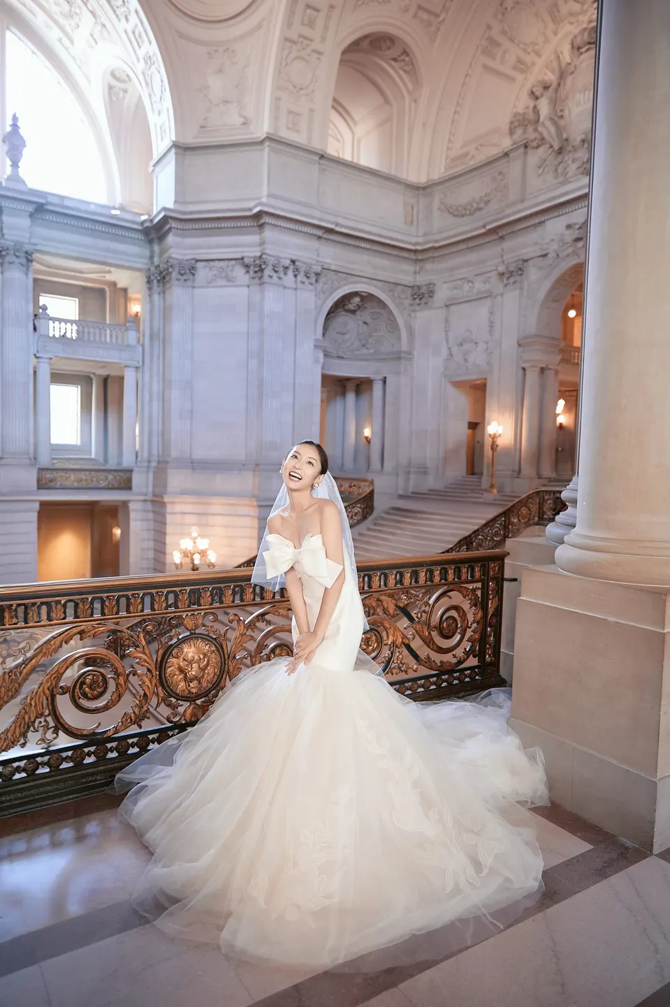 Bride in a bow-front gown at City Hall, frame 22 of 24