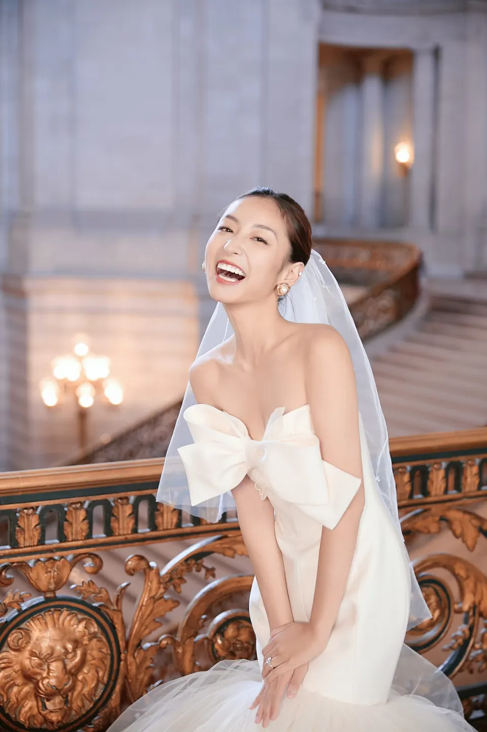 Bride in a bow-front gown at City Hall, frame 23 of 24