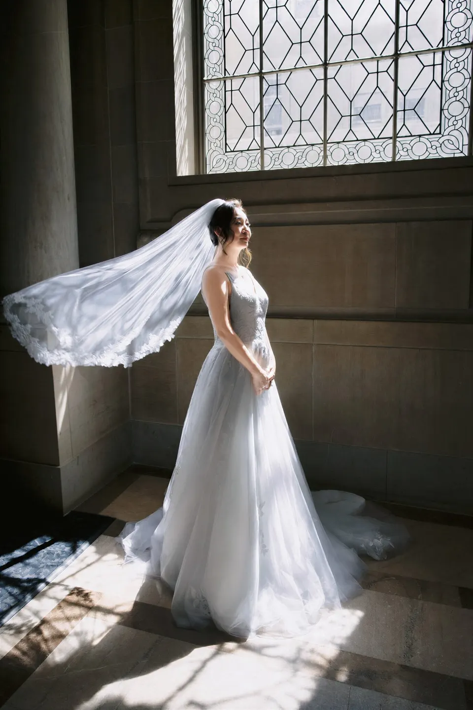 City Hall wedding in window light, frame 15 of 33