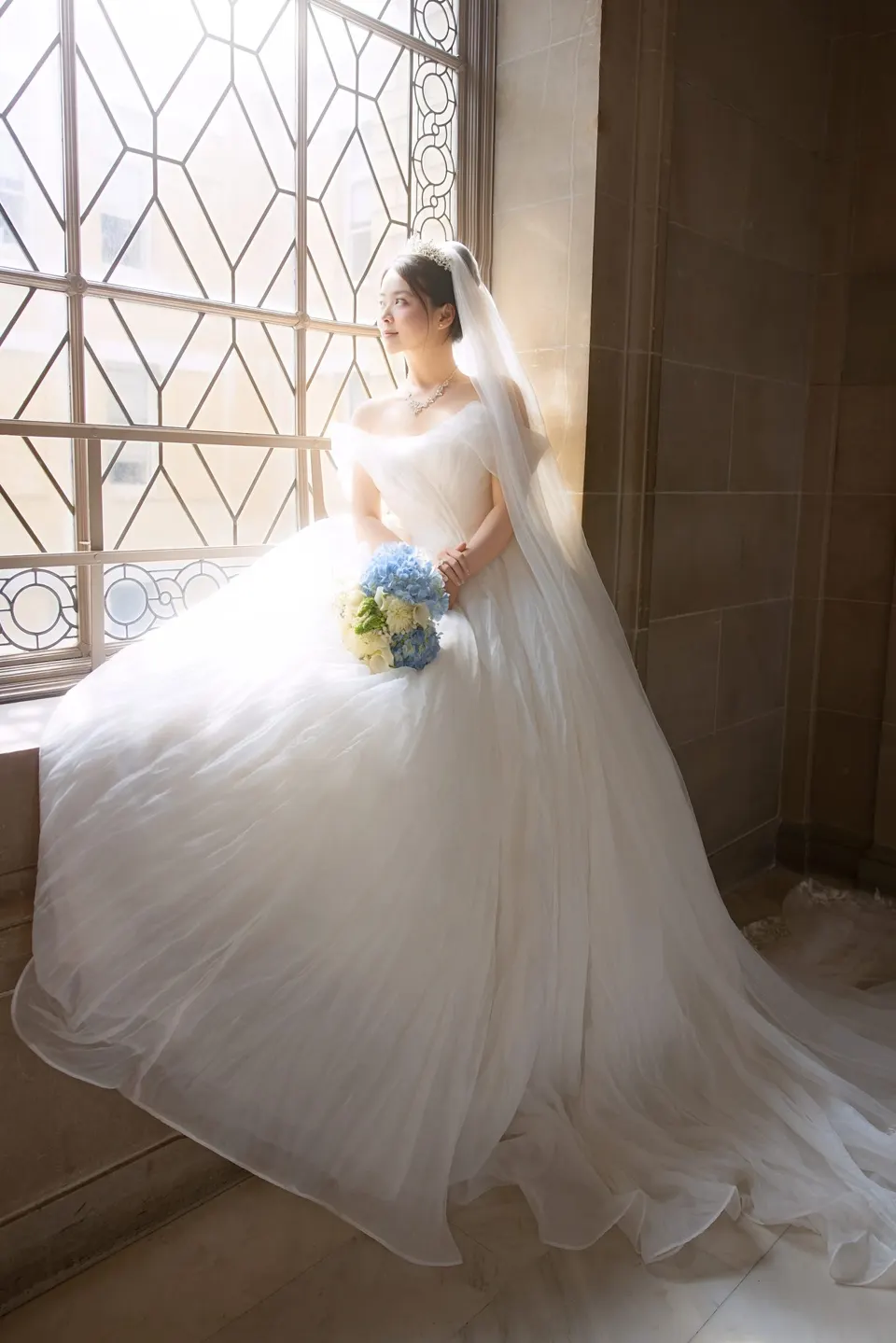 Bride with a long train at City Hall