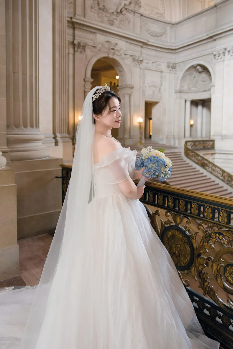 Bride with a long train at City Hall, frame 2 of 9
