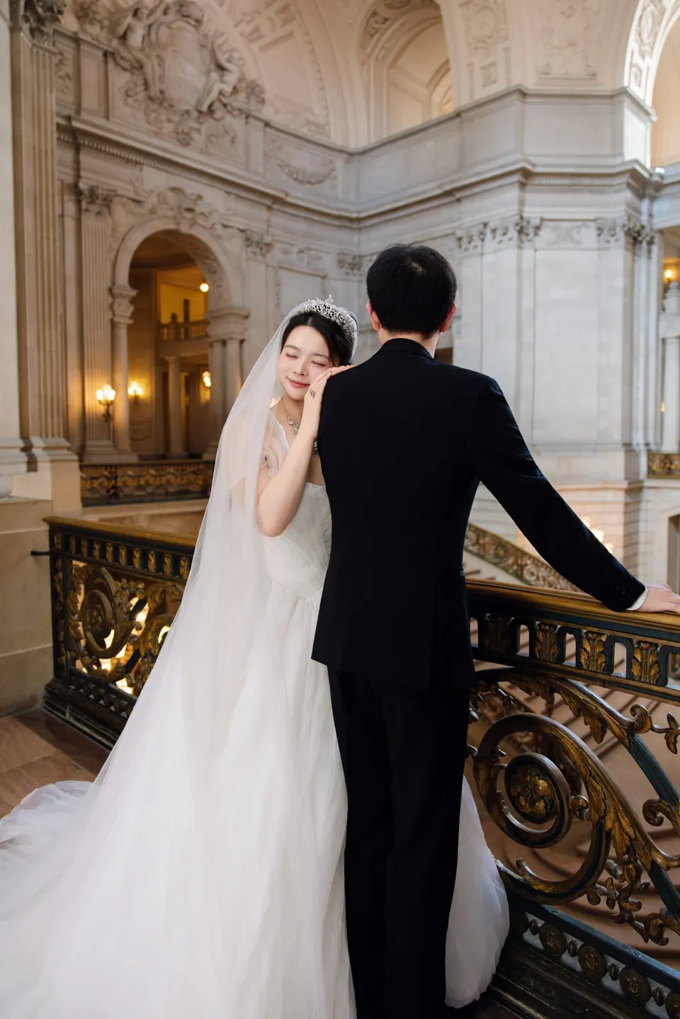 Bride with a long train at City Hall, frame 4 of 9
