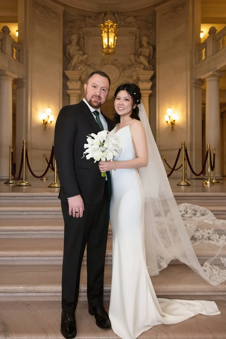 City Hall wedding with calla lilies and a long lace veil