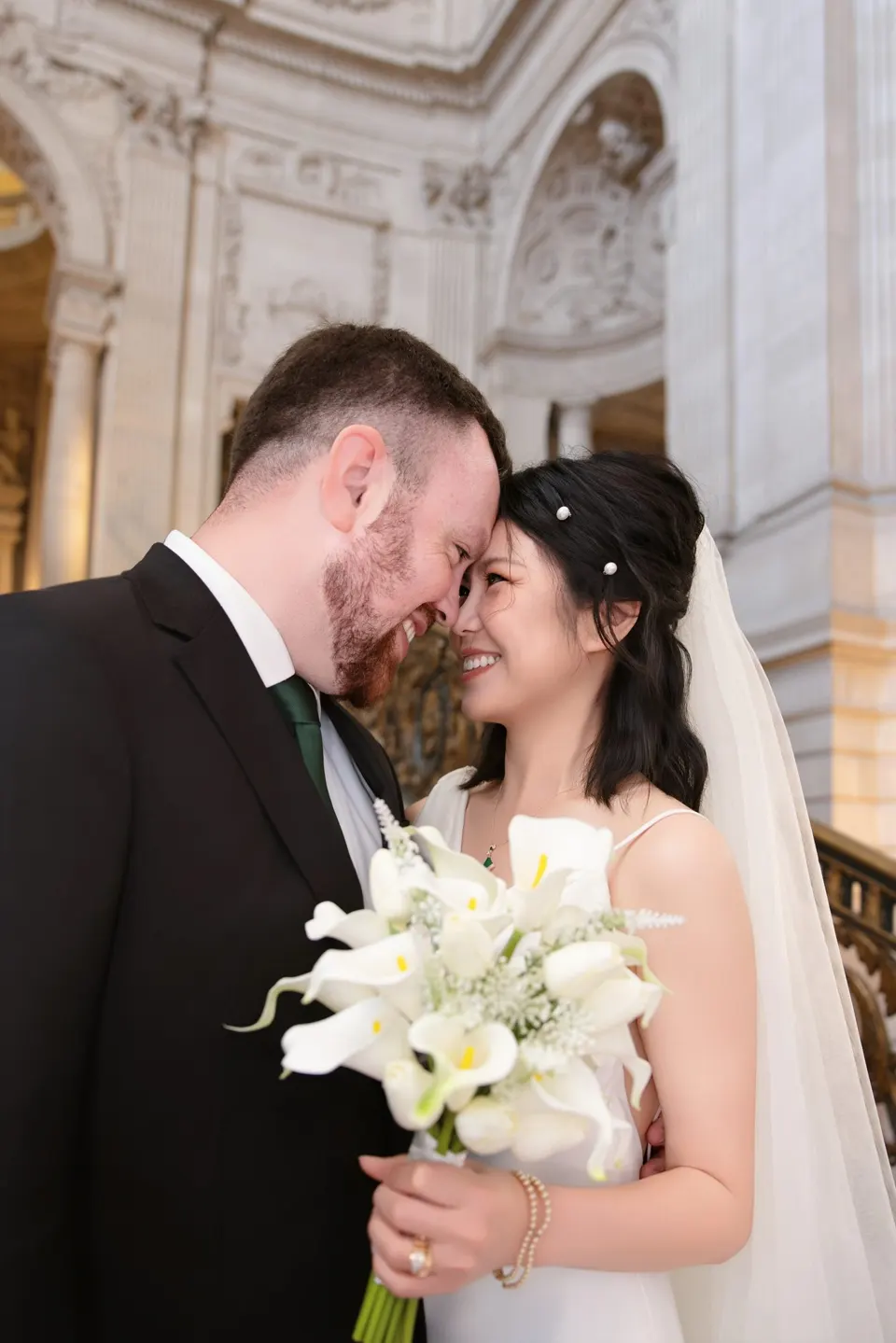 City Hall wedding with calla lilies and a long lace veil, frame 2 of 25