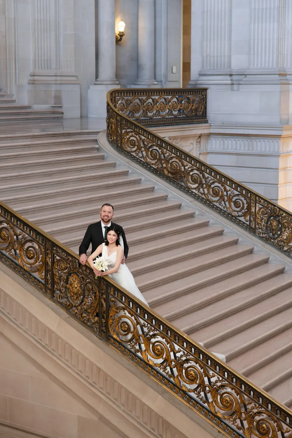 City Hall wedding with calla lilies and a long lace veil, frame 3 of 25