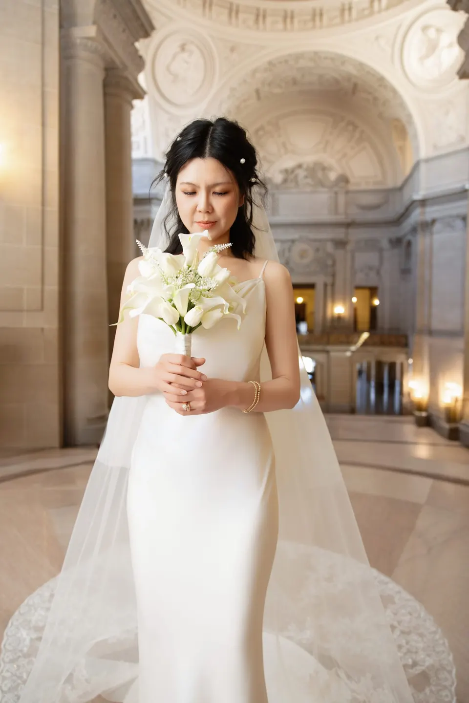 City Hall wedding with calla lilies and a long lace veil, frame 4 of 25