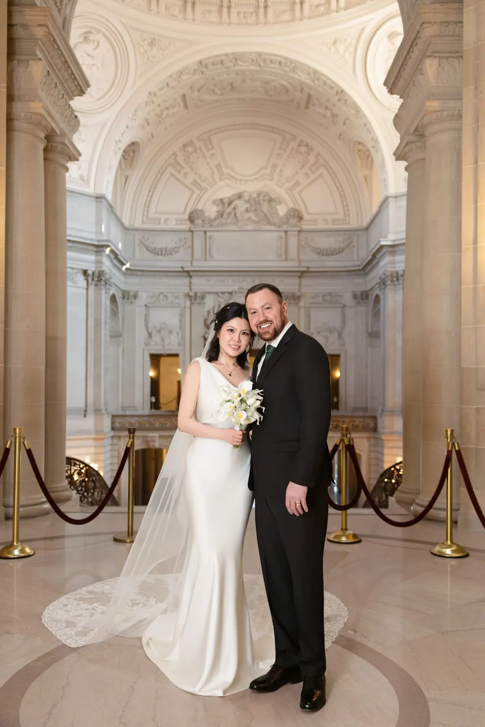 City Hall wedding with calla lilies and a long lace veil, frame 5 of 25