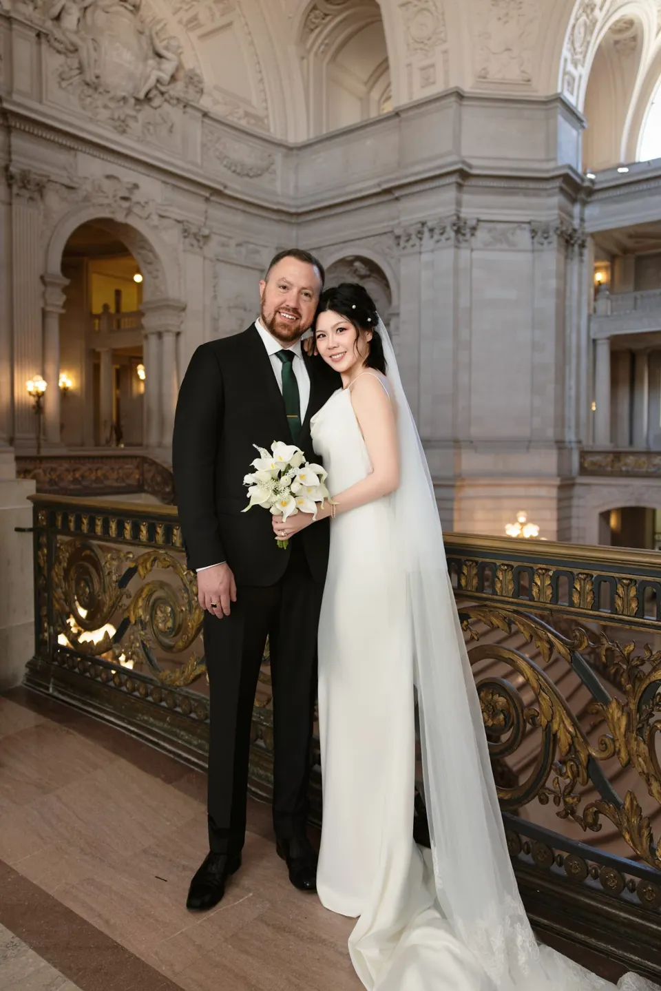 City Hall wedding with calla lilies and a long lace veil, frame 11 of 25