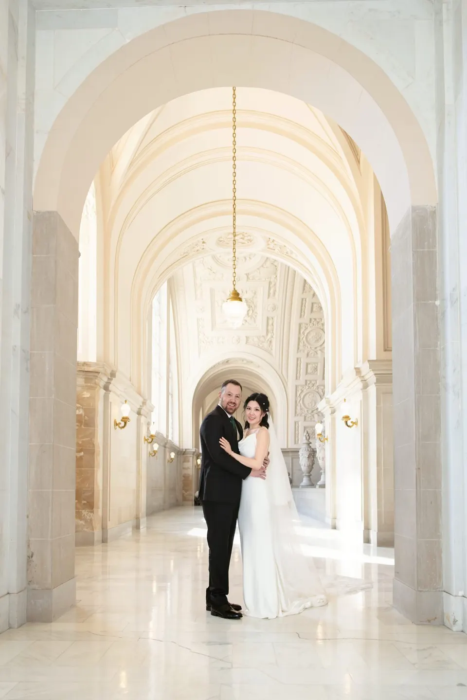 City Hall wedding with calla lilies and a long lace veil, frame 16 of 25