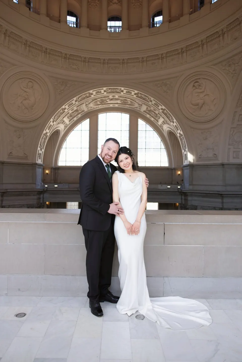 City Hall wedding with calla lilies and a long lace veil, frame 19 of 25