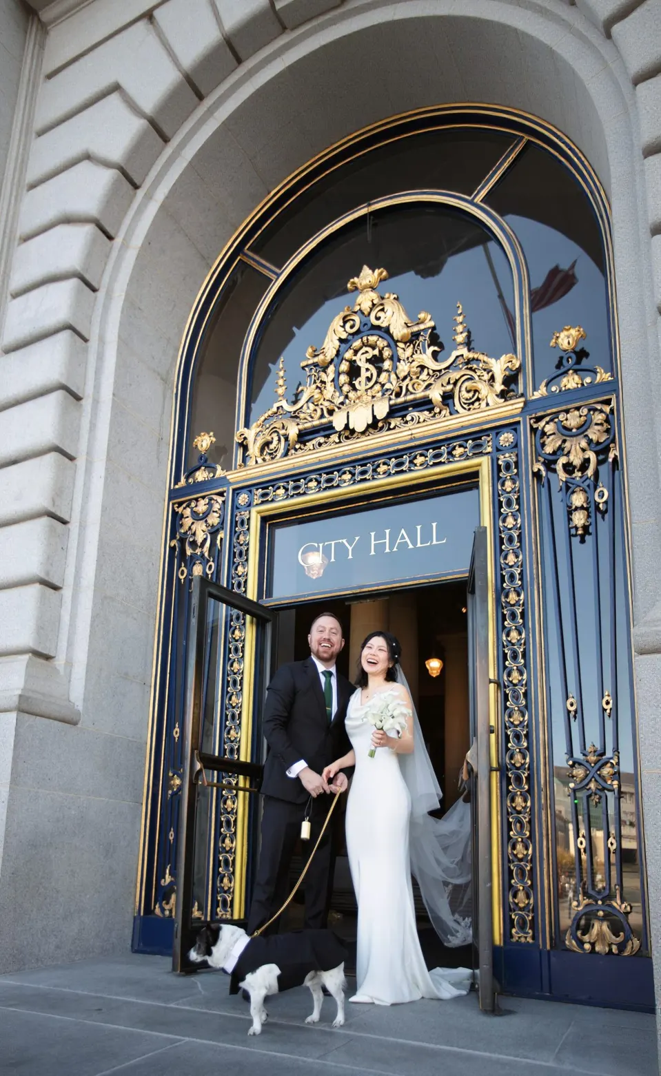City Hall wedding with calla lilies and a long lace veil, frame 21 of 25